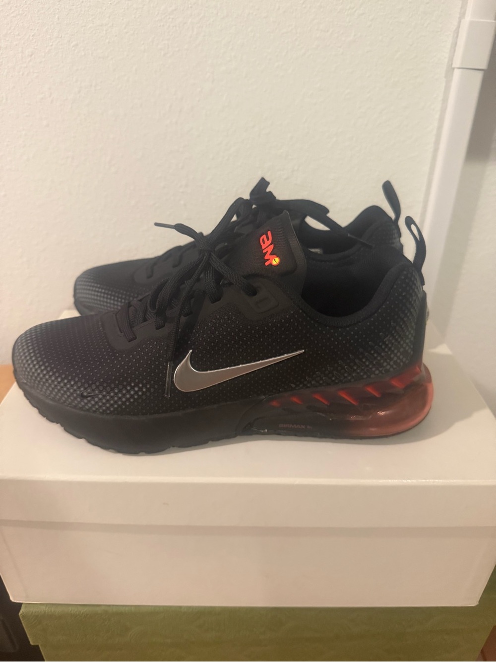 Nike Women’s Black Sneakers with Red Air Heel and Silver Swoosh